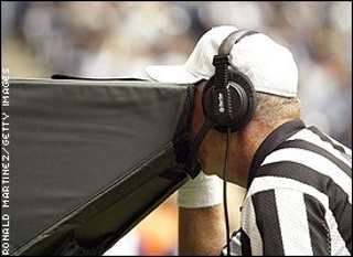 Referee viewing replay.